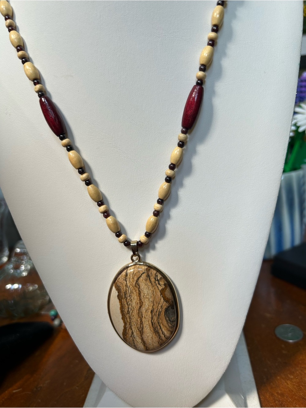 Handcrafted long wood necklace with stone pendant.